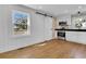 Updated kitchen with white cabinets, hardwood floors and a farmhouse sink at 4961 Baylor Ave, North Charleston, SC 29405