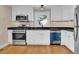 Modern kitchen with white cabinets and stainless steel appliances at 4961 Baylor Ave, North Charleston, SC 29405