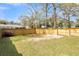 Large backyard with wooden fence and grassy area at 4961 Baylor Ave, North Charleston, SC 29405