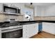 Modern kitchen with stainless steel appliances and granite countertops at 4961 Baylor Ave, North Charleston, SC 29405
