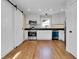 Bright kitchen featuring hardwood floors and a sliding barn door at 4961 Baylor Ave, North Charleston, SC 29405