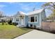 Side view of charming light blue cottage at 4961 Baylor Ave, North Charleston, SC 29405