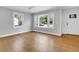 Bright living room with hardwood floors and large windows at 4961 Baylor Ave, North Charleston, SC 29405