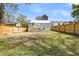 Back exterior of teal house with wooden deck and fence at 4961 Baylor Ave, North Charleston, SC 29405