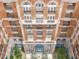 Indigo building exterior showcasing multiple balconies and courtyard at 609 King St # 603, Charleston, SC 29403