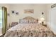 Guest bedroom with a queen-size bed and coastal decor at 11 Muirfield Village Ct, Summerville, SC 29483