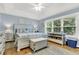 Spacious main bedroom with light blue walls and a king-size bed at 11 Muirfield Village Ct, Summerville, SC 29483