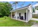 White workshop with covered porch at 11 Muirfield Village Ct, Summerville, SC 29483