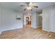 Open living room with hardwood floors and kitchen view at 2071 S Shore Dr, Charleston, SC 29407