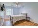 Bedroom with wood floors, ceiling fan, and window at 2071 S Shore Dr, Charleston, SC 29407