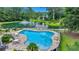 Community pool with a pond view and plenty of seating at 215 Angora Way, Summerville, SC 29485