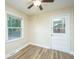 Bedroom with vinyl flooring, ceiling fan, and exterior access at 4418 Cindy Ln, North Charleston, SC 29418