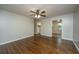 Open living room with hardwood floors, offering views into the kitchen area at 4418 Cindy Ln, North Charleston, SC 29418