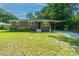 Brick ranch house with a spacious lawn, offering curb appeal at 4418 Cindy Ln, North Charleston, SC 29418