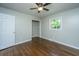 Bedroom with hardwood floors, neutral walls, and a large closet at 4418 Cindy Ln, North Charleston, SC 29418