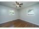 Bedroom with hardwood floors, neutral walls and two windows at 4418 Cindy Ln, North Charleston, SC 29418