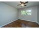 Spacious bedroom with hardwood floors and ceiling fan at 4418 Cindy Ln, North Charleston, SC 29418