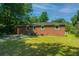 Brick home with a spacious backyard and patio at 4418 Cindy Ln, North Charleston, SC 29418