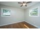 Bedroom with hardwood floors, neutral walls, and two windows at 4418 Cindy Ln, North Charleston, SC 29418