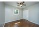 Simple bedroom with hardwood floors, a ceiling fan, and ample closet space at 4418 Cindy Ln, North Charleston, SC 29418