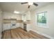 Eat-in kitchen with white cabinets and vinyl flooring at 4418 Cindy Ln, North Charleston, SC 29418