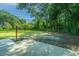 Spacious backyard with a large concrete patio and surrounding trees at 4418 Cindy Ln, North Charleston, SC 29418
