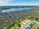 Aerial view of a waterfront community with new homes and marsh views at 1095 Saltwater Cir, Johns Island, SC 29455