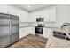 Modern kitchen with stainless steel appliances and granite countertops at 2312 Meridian Rd, North Charleston, SC 29405