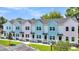 Row of pastel-colored townhouses with parking at 2312 Meridian Rd, North Charleston, SC 29405