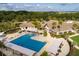 Aerial view of community lap pool with adjacent clubhouse and shade structures at 3350 Seabrook Island Rd, Seabrook Island, SC 29455