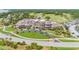 Aerial view of community clubhouse near golf course with ample parking at 3350 Seabrook Island Rd, Seabrook Island, SC 29455