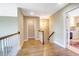 Hardwood floor hallway with access to bedrooms and laundry room at 3350 Seabrook Island Rd, Seabrook Island, SC 29455
