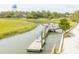 Wooden dock extending into calm waterway, near lush greenery at 3350 Seabrook Island Rd, Seabrook Island, SC 29455