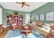Relaxing Gathering room with green walls, hardwood floors, and comfortable seating at 3350 Seabrook Island Rd, Seabrook Island, SC 29455