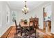 Elegant dining room features a wooden table, chandelier, and area rug at 3350 Seabrook Island Rd, Seabrook Island, SC 29455