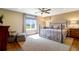 Main bedroom with large window, hardwood floors, and a ceiling fan at 3350 Seabrook Island Rd, Seabrook Island, SC 29455