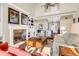 Two-story living room with hardwood floors, fireplace, and built-in shelving at 3350 Seabrook Island Rd, Seabrook Island, SC 29455