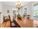 Formal dining room with hardwood floors, chandelier, and access to kitchen at 3350 Seabrook Island Rd, Seabrook Island, SC 29455