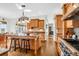 Eat-in kitchen with granite island, hardwood floors, and stainless steel appliances at 3350 Seabrook Island Rd, Seabrook Island, SC 29455