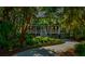 Two story home with a landscaped lawn and driveway at 3350 Seabrook Island Rd, Seabrook Island, SC 29455