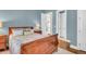 Charming bedroom with a wooden sleigh bed, soft color palette, and plenty of natural light at 3350 Seabrook Island Rd, Seabrook Island, SC 29455