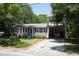Charming two-story home with a large yard and driveway at 1302 E Ashley Ave, Folly Beach, SC 29439