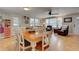 Light and airy dining area with wood table and chairs at 1302 E Ashley Ave, Folly Beach, SC 29439