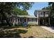 Two-story home with attached garage and a spacious yard at 1302 E Ashley Ave, Folly Beach, SC 29439