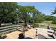 Deck overlooking a grassy area with trees and parked cars at 1302 E Ashley Ave, Folly Beach, SC 29439
