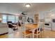 Open concept kitchen and living area with dining table and seating at 1302 E Ashley Ave, Folly Beach, SC 29439