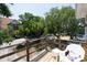 Relaxing deck with a white wicker chair, offering a view of the street at 1302 E Ashley Ave, Folly Beach, SC 29439