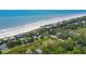 Aerial view of beach, neighborhood and property at 1302 E Ashley Ave, Folly Beach, SC 29439
