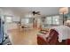 Bright living room with comfy furniture, wood floors, and open kitchen at 1302 E Ashley Ave, Folly Beach, SC 29439