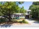 Two-story home with a spacious yard and attached garage at 1302 E Ashley Ave, Folly Beach, SC 29439